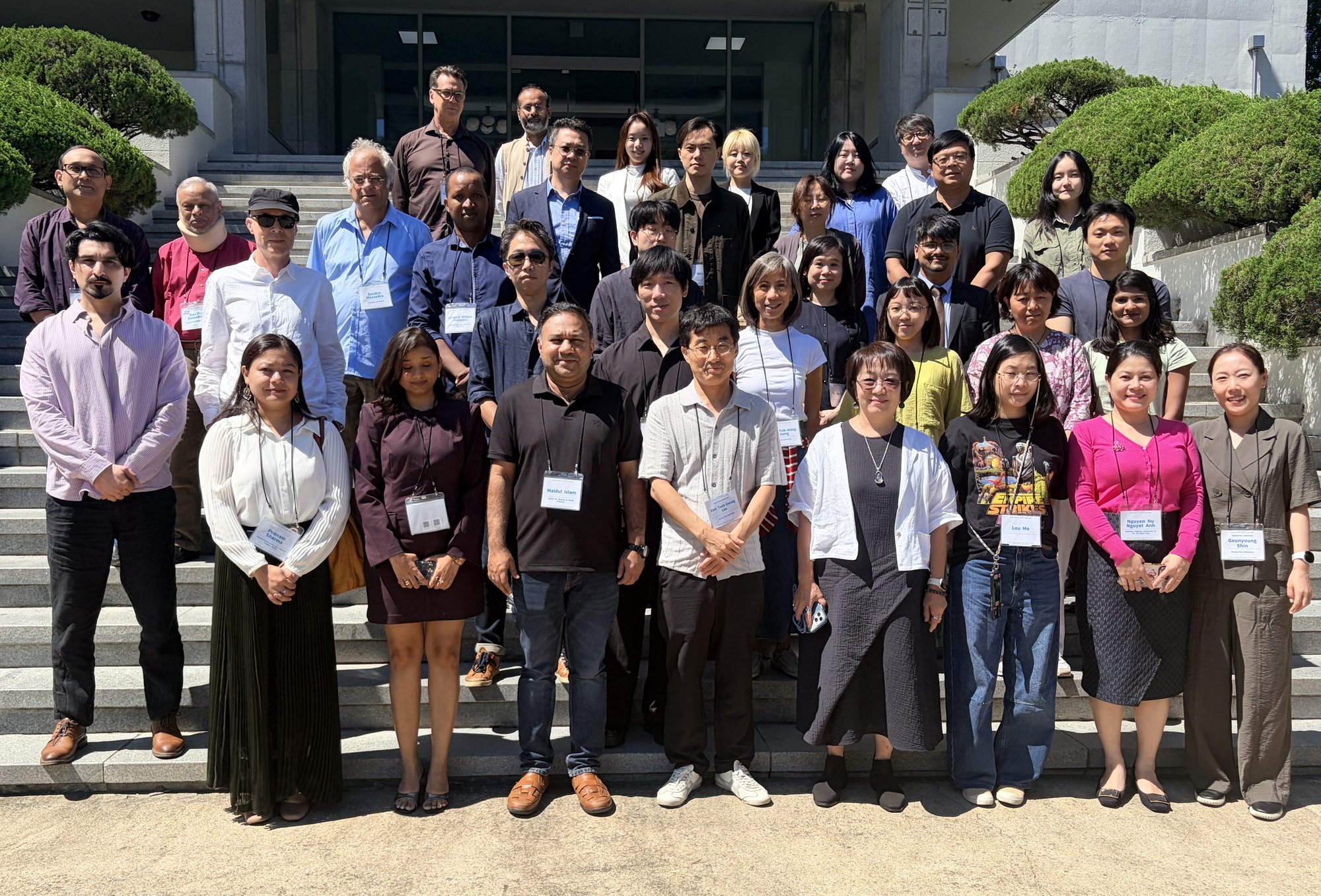 Group photo of 2026 TARN Meeting participants on the steps of the Global Campus, Kyung Hee University